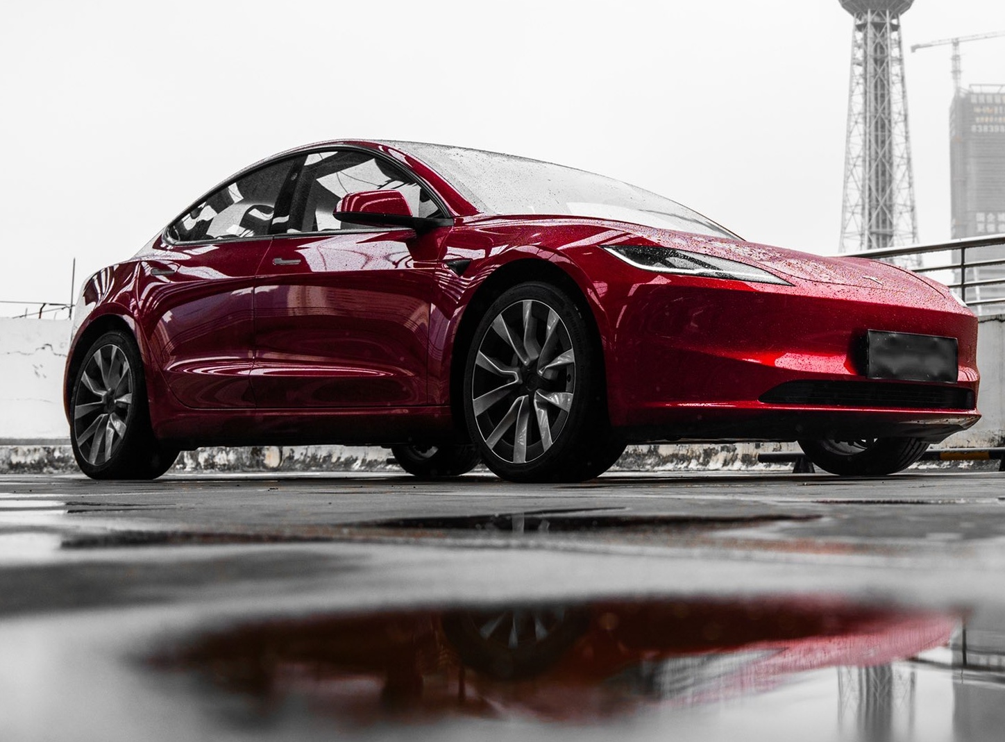 tesla model 3 logo red.jpeg