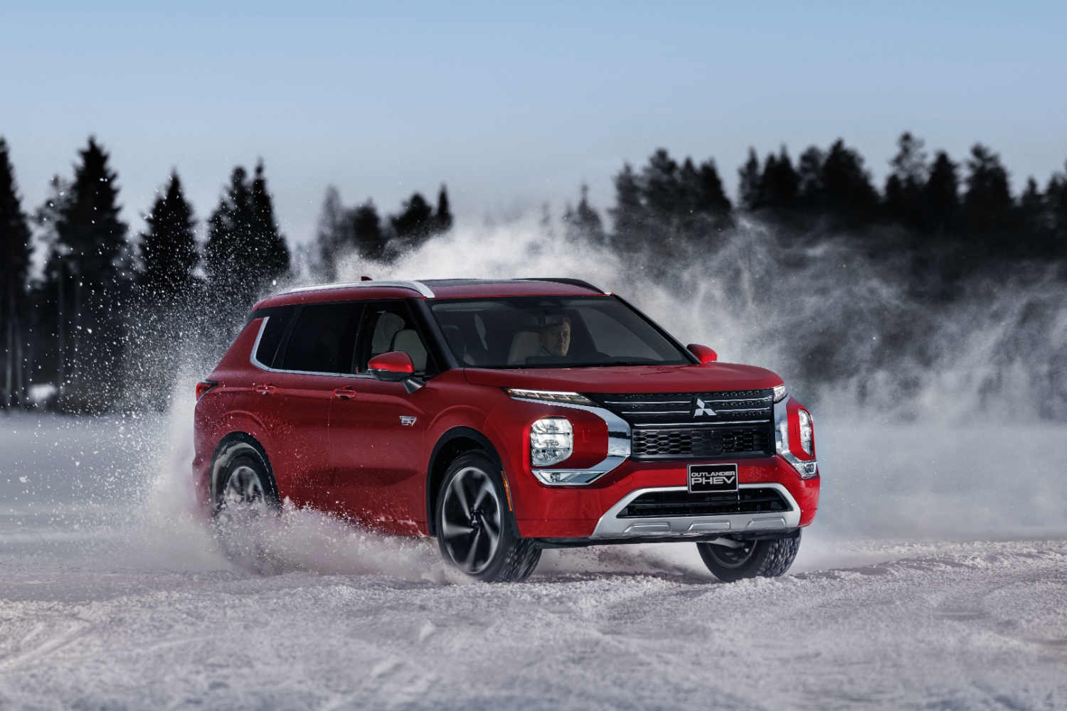 Mitsubishi tests the new Outlander plug-in hybrid in the icy lakes of Finland.