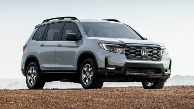 2023 Honda Passport TrailSport in grey on top of a hill.