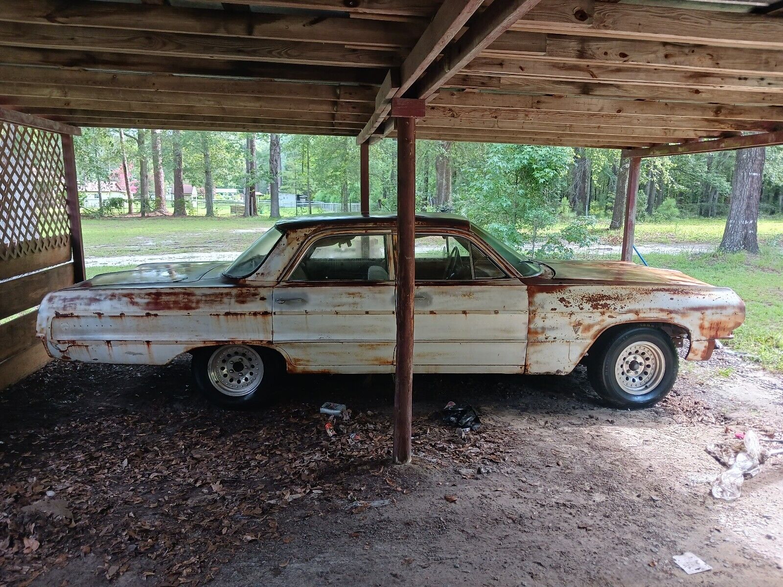 call 911 once gorgeous 1964 chevrolet impala parked under a carport needs urgent help 231790 1.jpeg