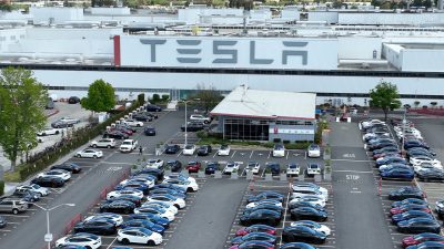 tesla worker showered factory slept laid off.jpg