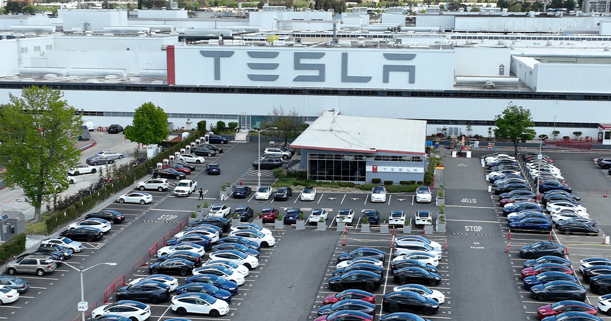 tesla worker showered factory slept laid off.jpg