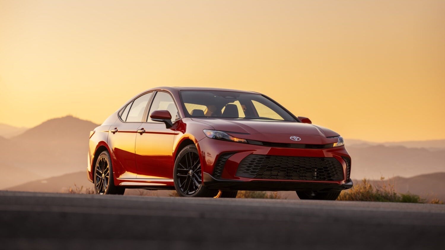 red sedan car during sunset