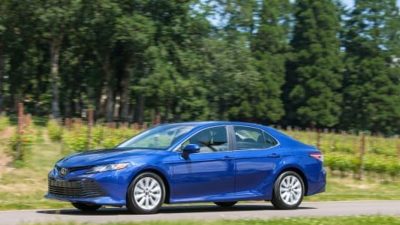 Ken Hoffman celebrates his miraculously fuel efficient Toyota Camry