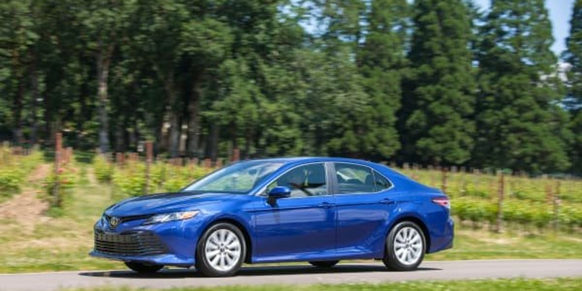 Ken Hoffman celebrates his miraculously fuel efficient Toyota Camry