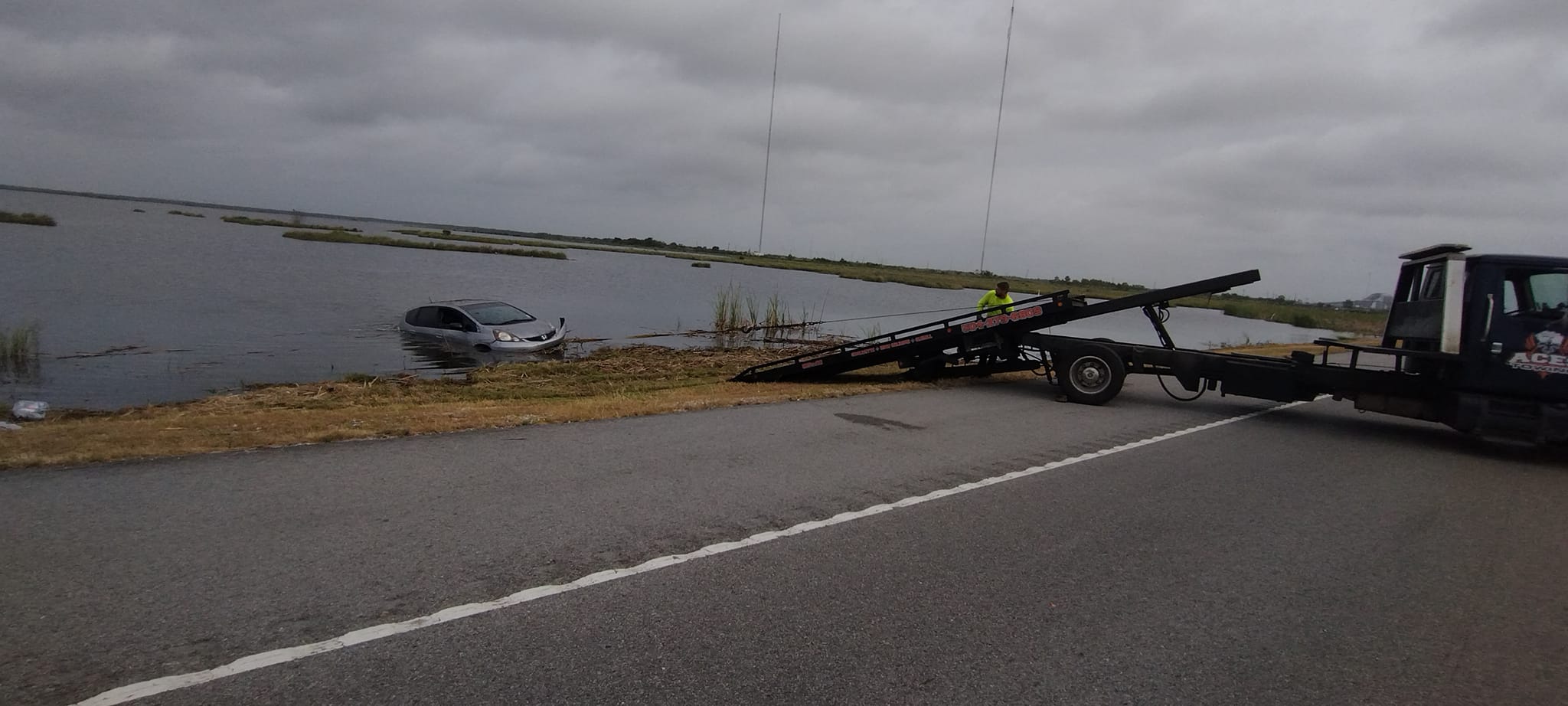 Honda Fit fished out of the water after encounter with alligator