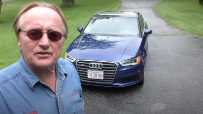 Scotty Kilmer Next to a 2015 Audi A3 Sedan