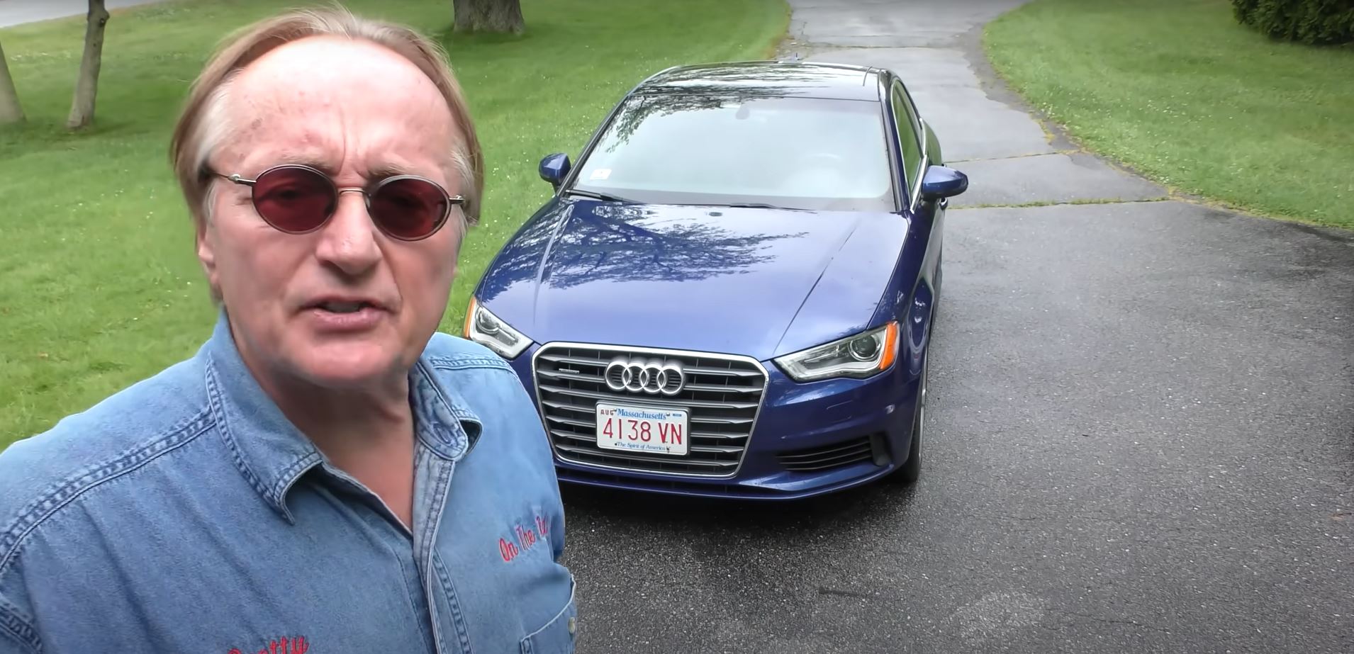 Scotty Kilmer Next to a 2015 Audi A3 Sedan