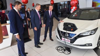 chris bowen with an electric nissan leaf vehicle aap.jpg