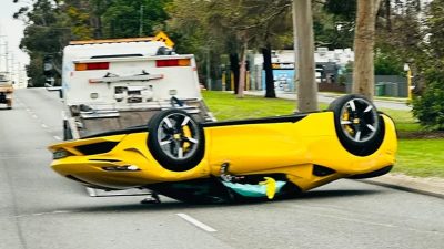 Ferrari flips onto its roof